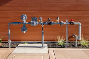 Gas line with red seismic shutoff valve